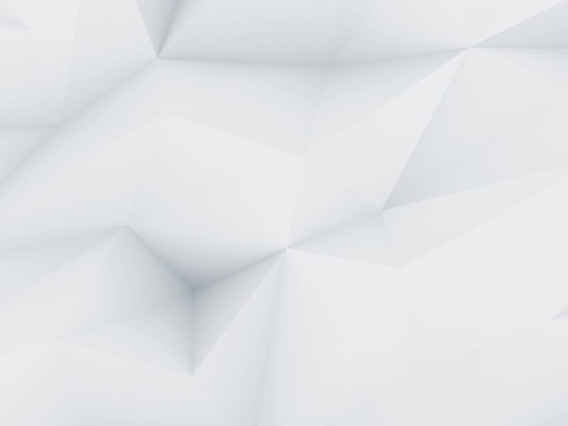 Un fond abstrait blanc et gris présente des formes géométriques angulaires et des ombres douces.