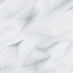 Un fond abstrait blanc et gris clair avec des formes géométriques polygonales.