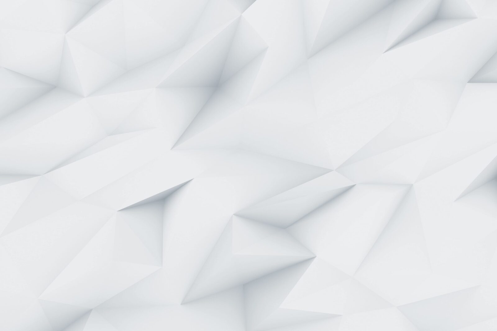Un fond abstrait blanc et gris clair avec des formes géométriques polygonales.