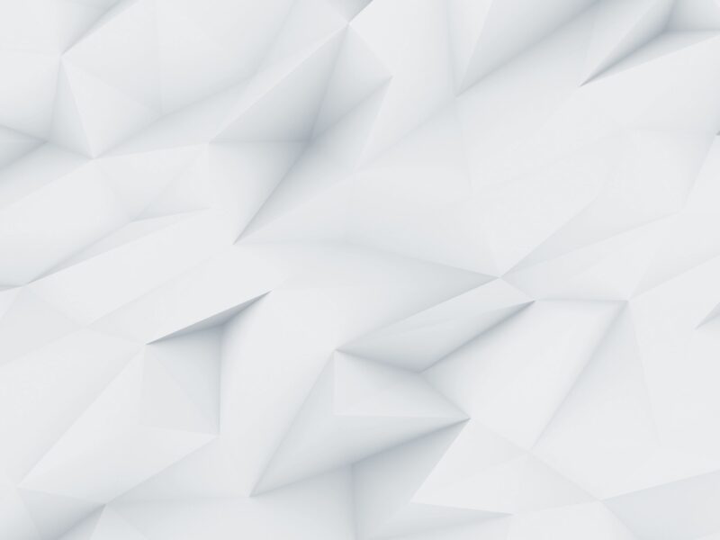 Un fond abstrait blanc et gris clair avec des formes géométriques polygonales.