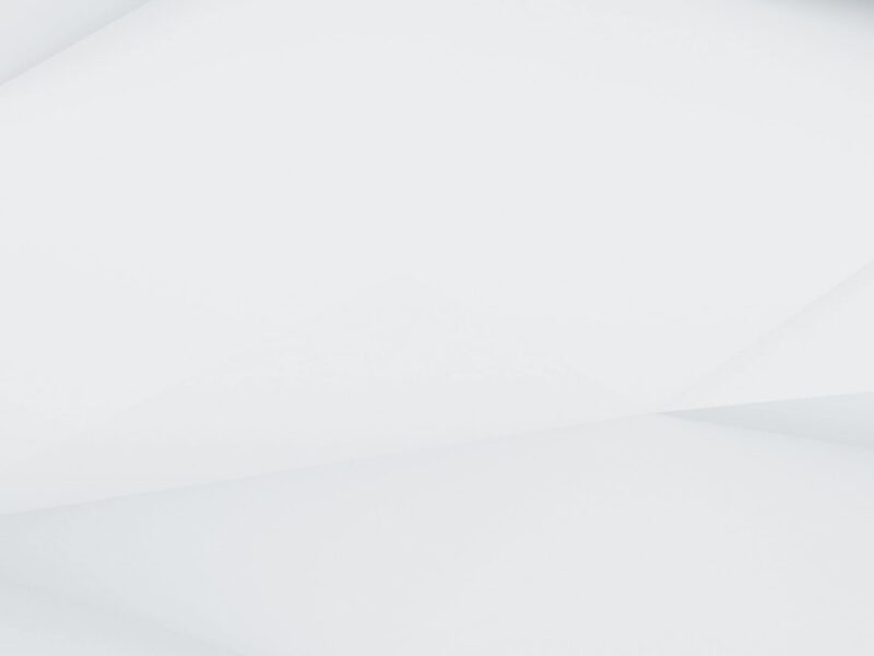 Fond abstrait blanc avec des formes géométriques angulaires et des ombres douces.