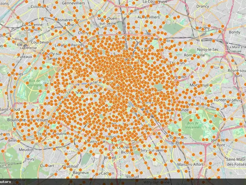 Carte de Paris couverte de nombreux points orange représentant les stations Vélib.